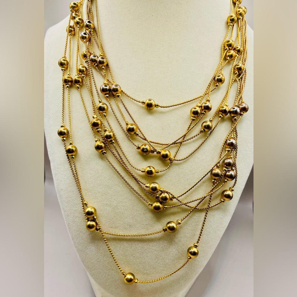 Long 5 strand gold bead station necklace. 35 inches. Can be doubled. Colorful.